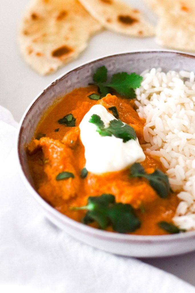 Easy Butter Chicken in a white bowl with rice