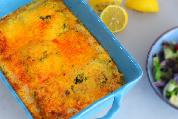 An easy delicious fish bake cooked in a creamy sauce with loads of cheese