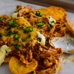 Spicy Chicken and Tortilla Chips smothered with gooey cheese