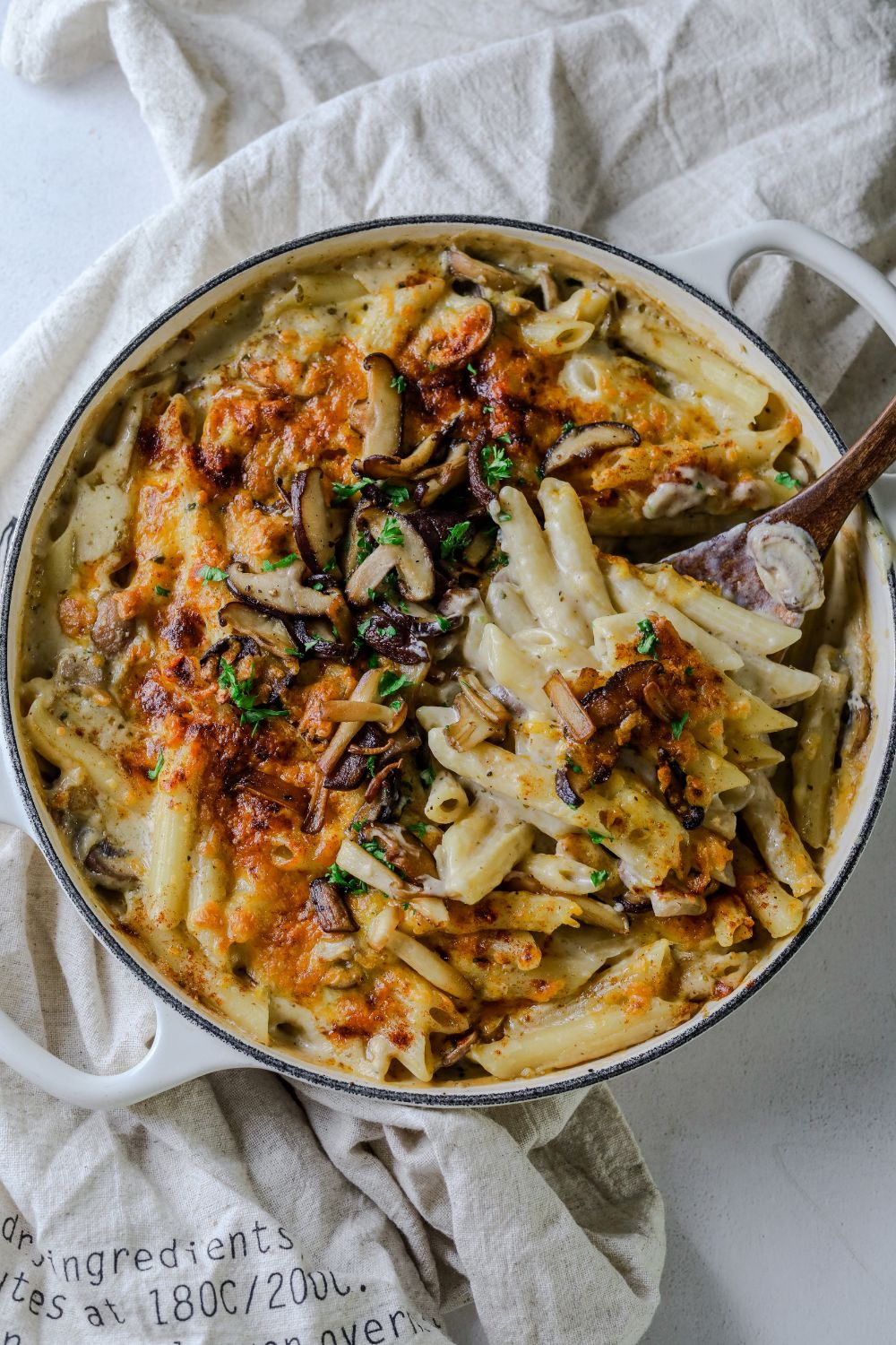 Creamy Mushroom Pasta in a white pot with a spoon on the right