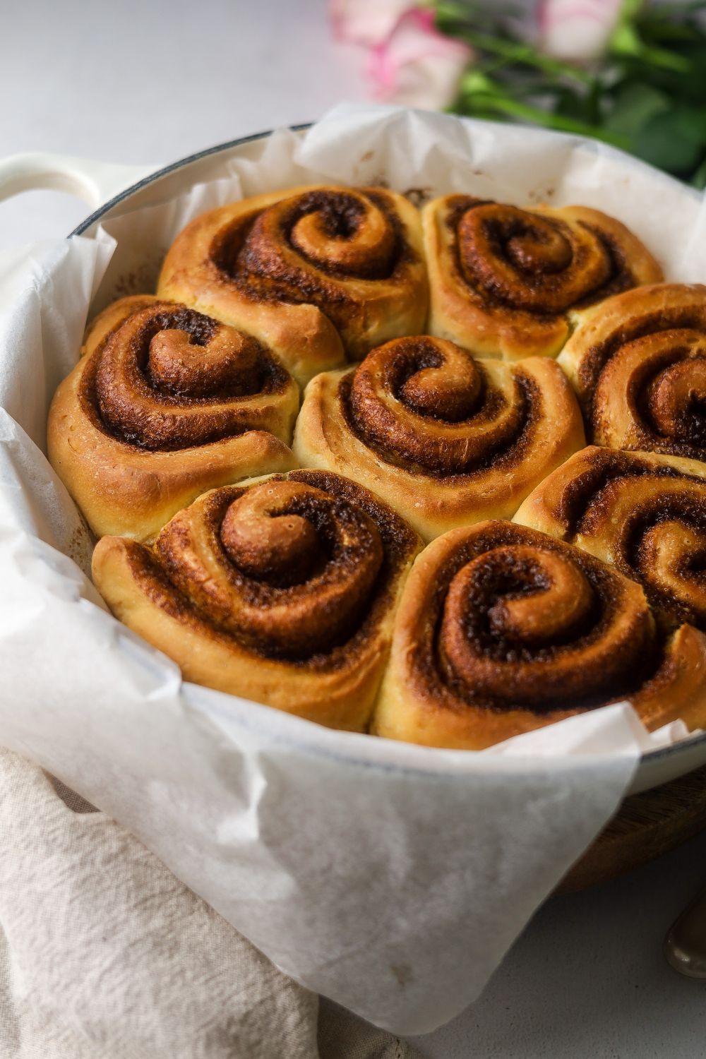 Cinnamon Buns in a white cast iron casserole
