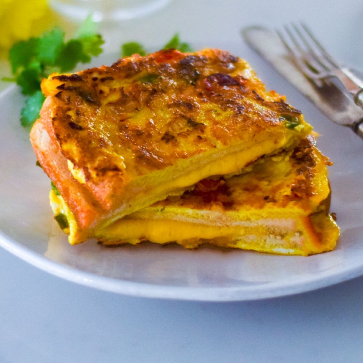 Indian Bread Omelette on a white plate