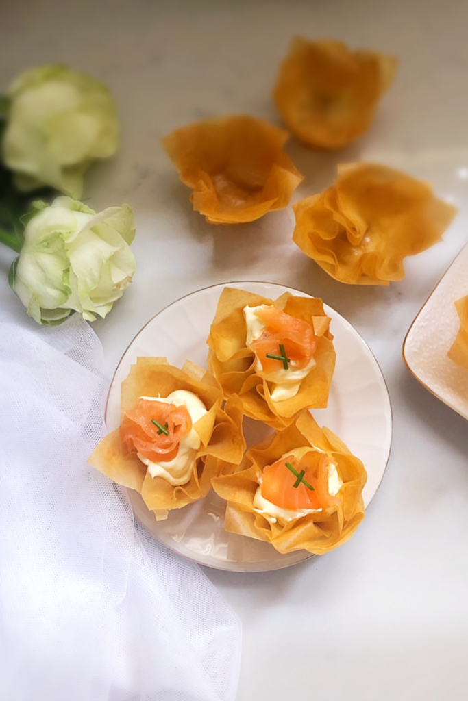 Phyllo cups filled with a cream cheese filling and topped with Salmon