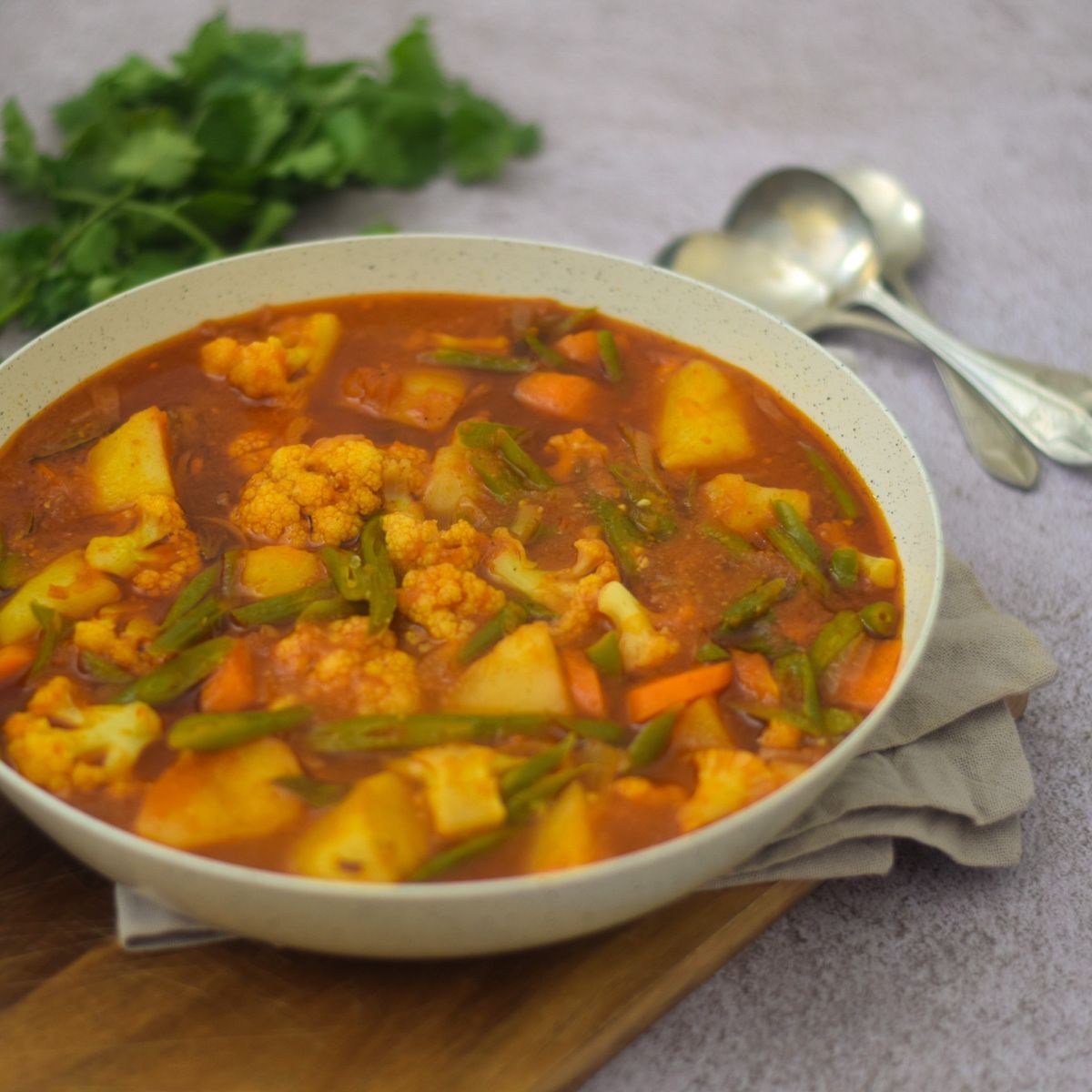 Mixed Vegetable Curry in a white pan