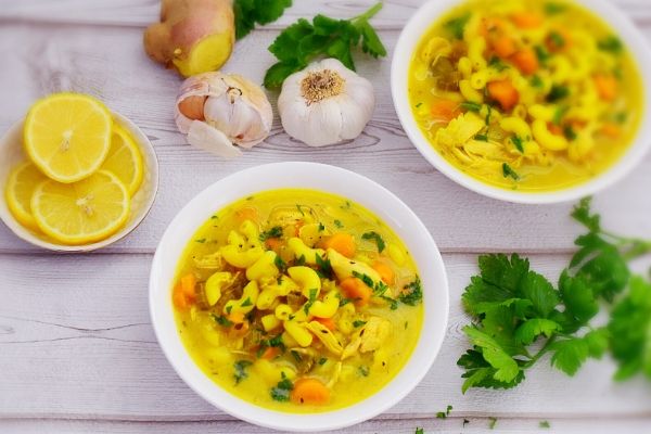 Chicken Noodle soup in two white bowls