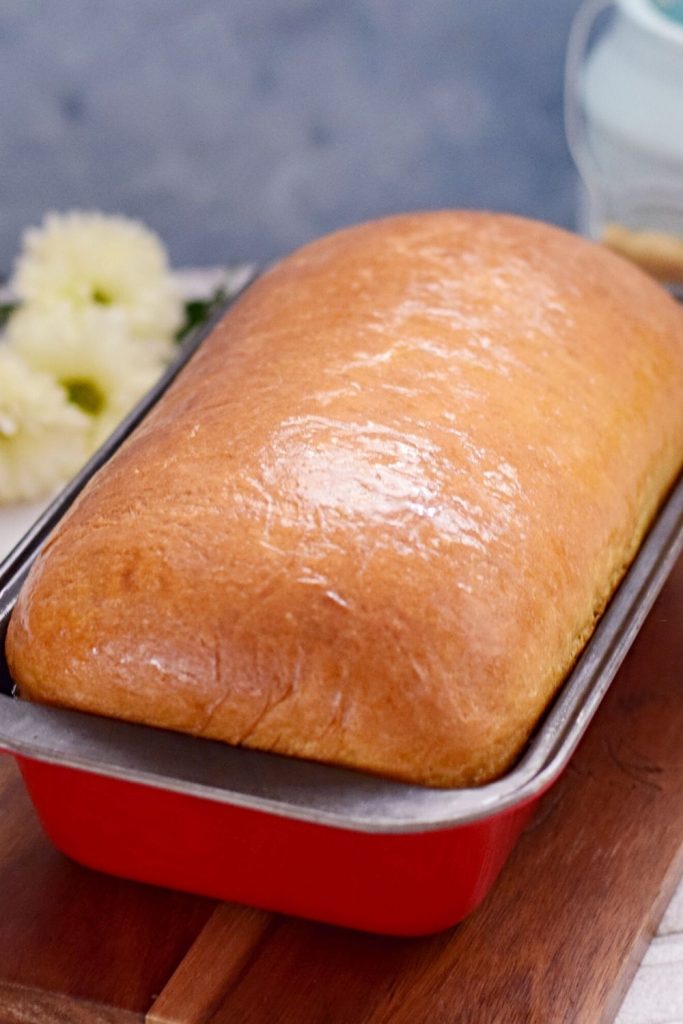 Freshly baked bread in a loaf pan