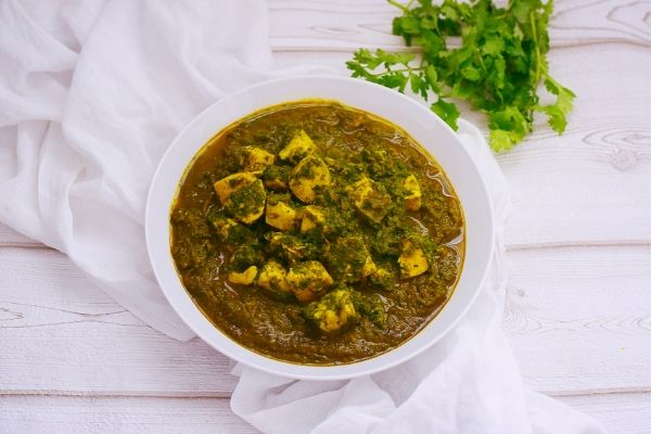 Spinach and Chicken Curry in a white bowl