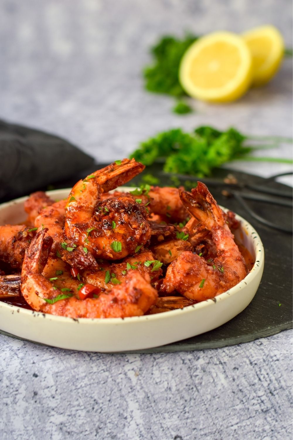 Chilli Garlic Butter Prawns in a white plate