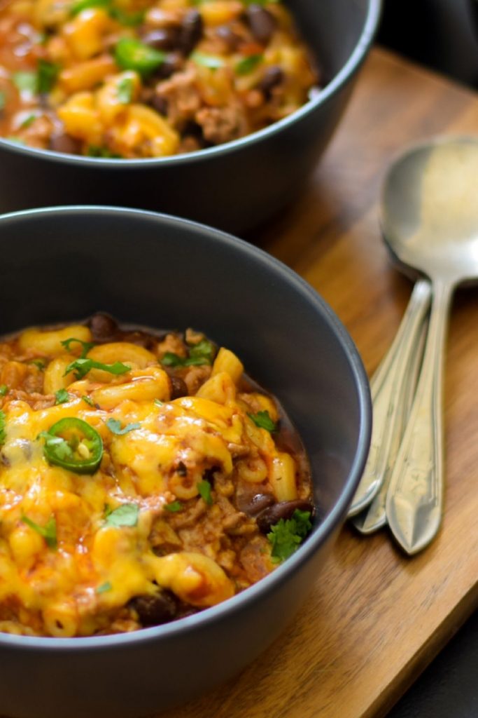 Chili Mac and Cheese in black bowls