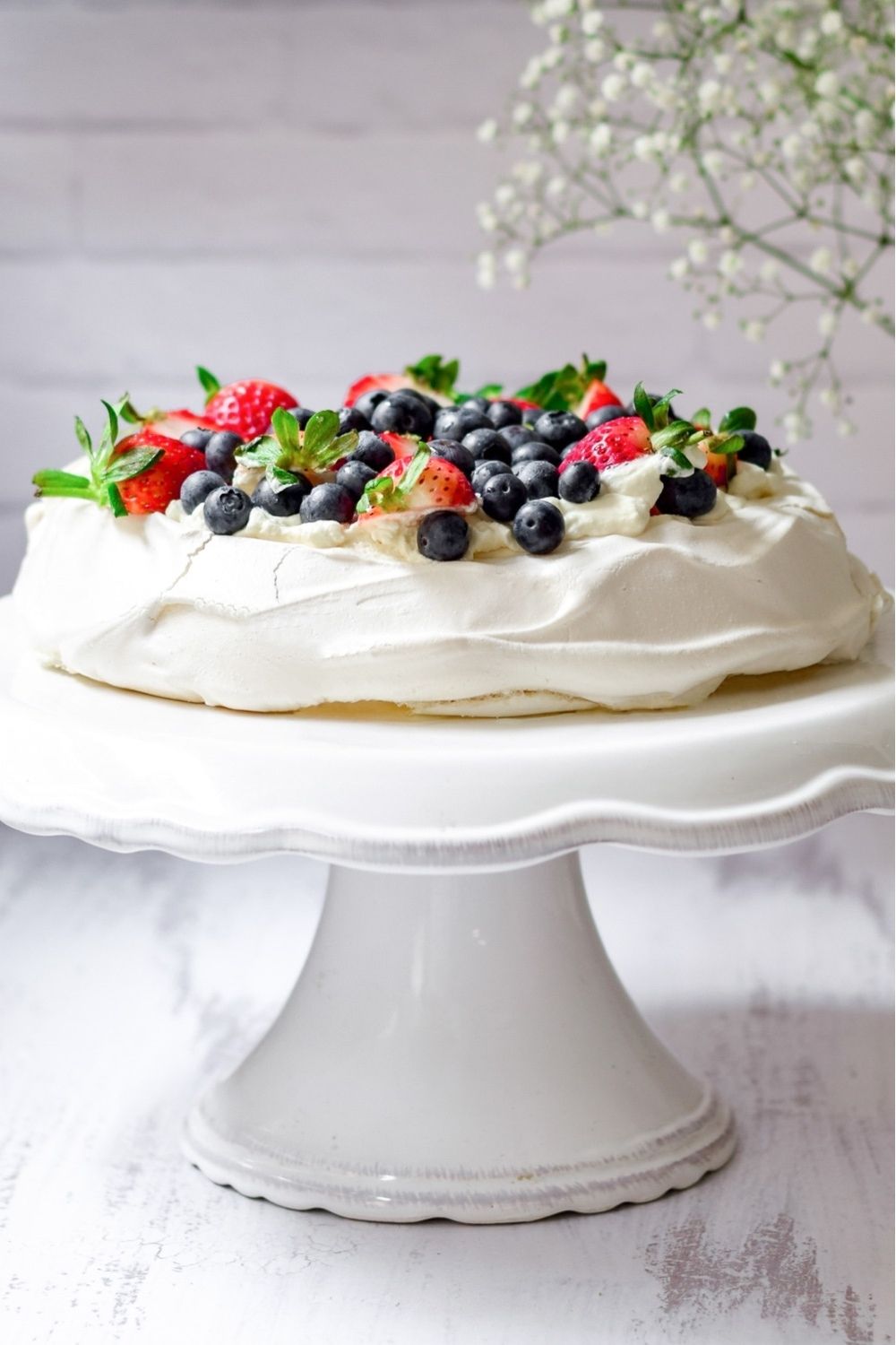 Easy Pavlova on a white cake stand
