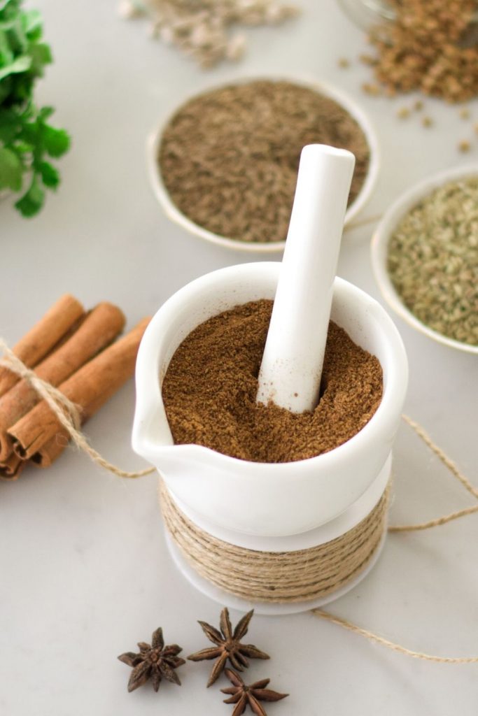 Garam Masala, Indian spice in a white pestle and mortar