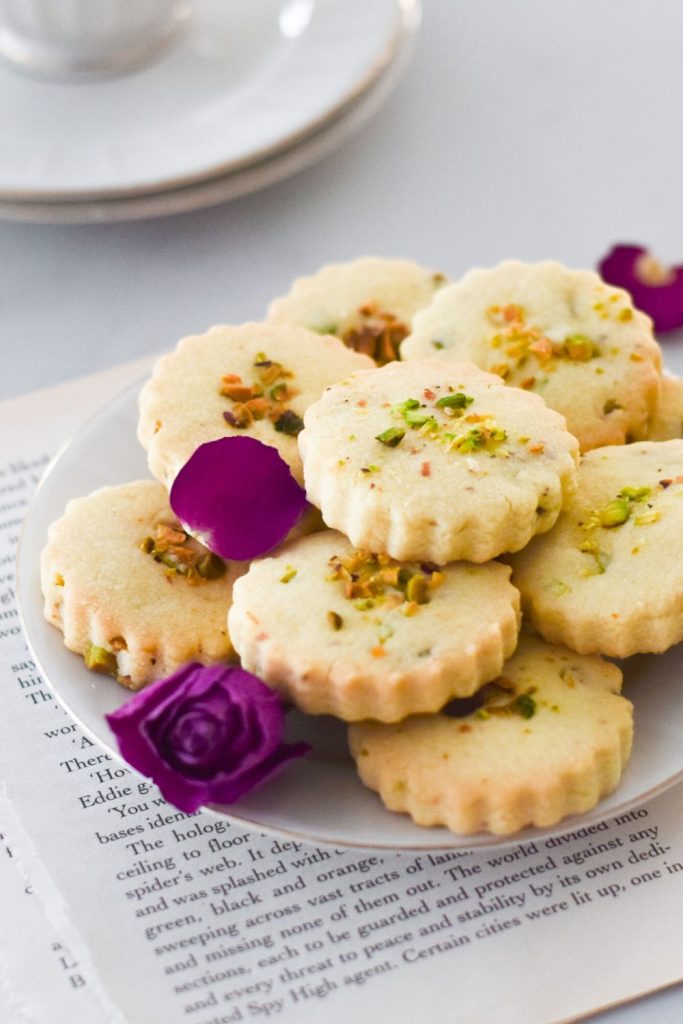 Rose Pistachio Shortbread Cookies on a white plate