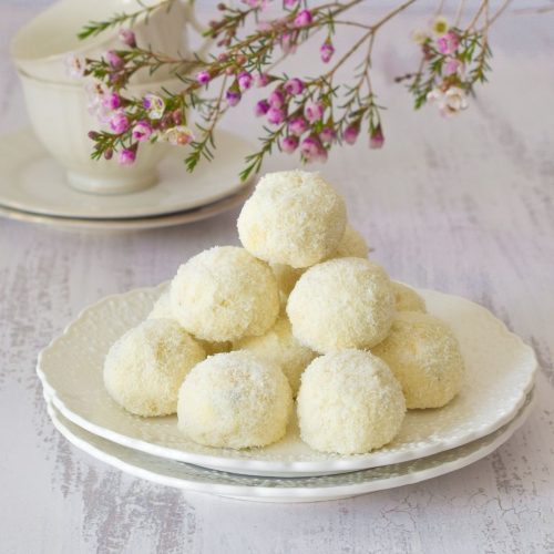 Nutty Chocolate Coconut Cookies on a white plate with flowers on top