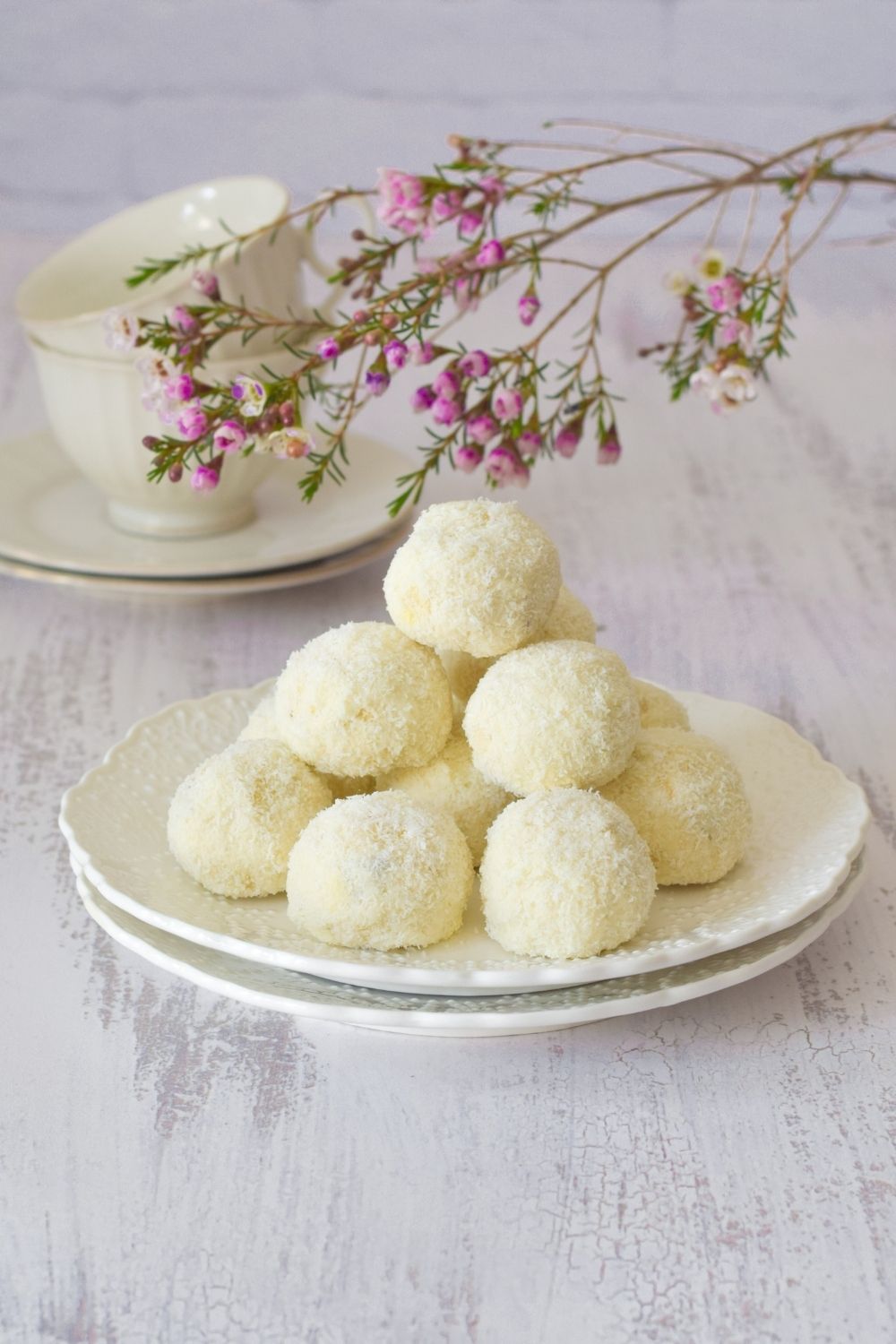 Nutty Chocolate Coconut Cookies on a white plate with flowers on top