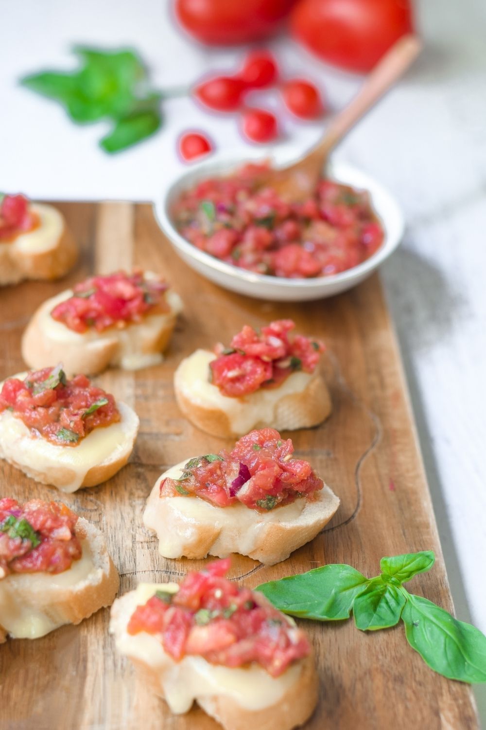 Bruschetta with mozarella on a wooden board