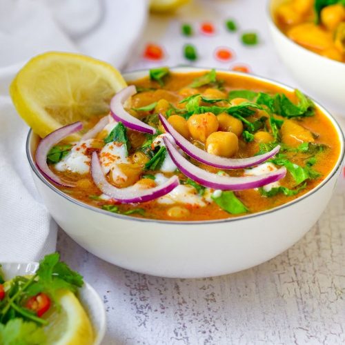 Chickpea Potato Spinach Curry in a white bowl