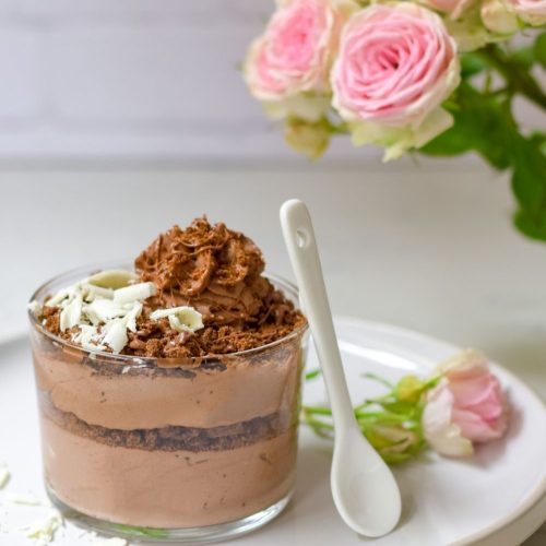 Chocolate Mousse with Romany Creams in a glass on a white plate