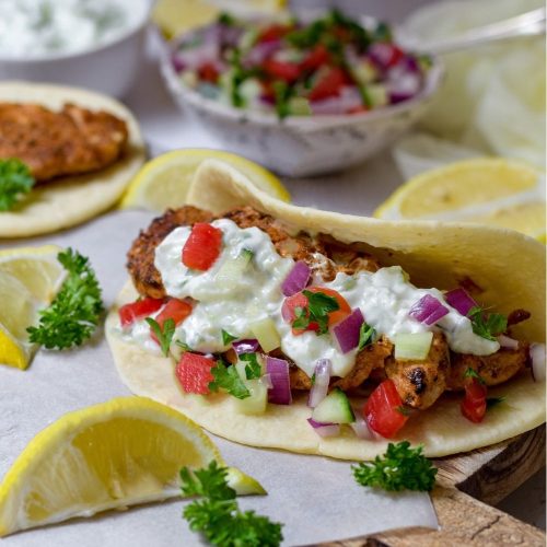Chicken Gyro with Tsatsiki on a wooden board