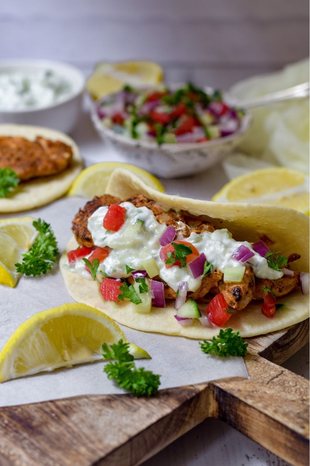 Chicken Gyro with Tsatsiki on a wooden board