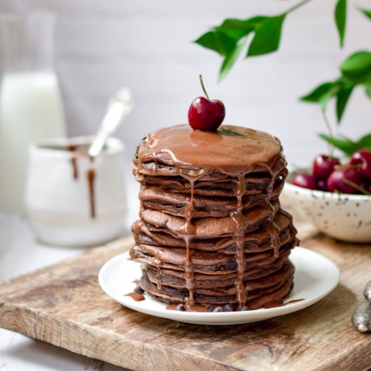 Fluffy Chocolate Pancakes with chocolate sauce drip