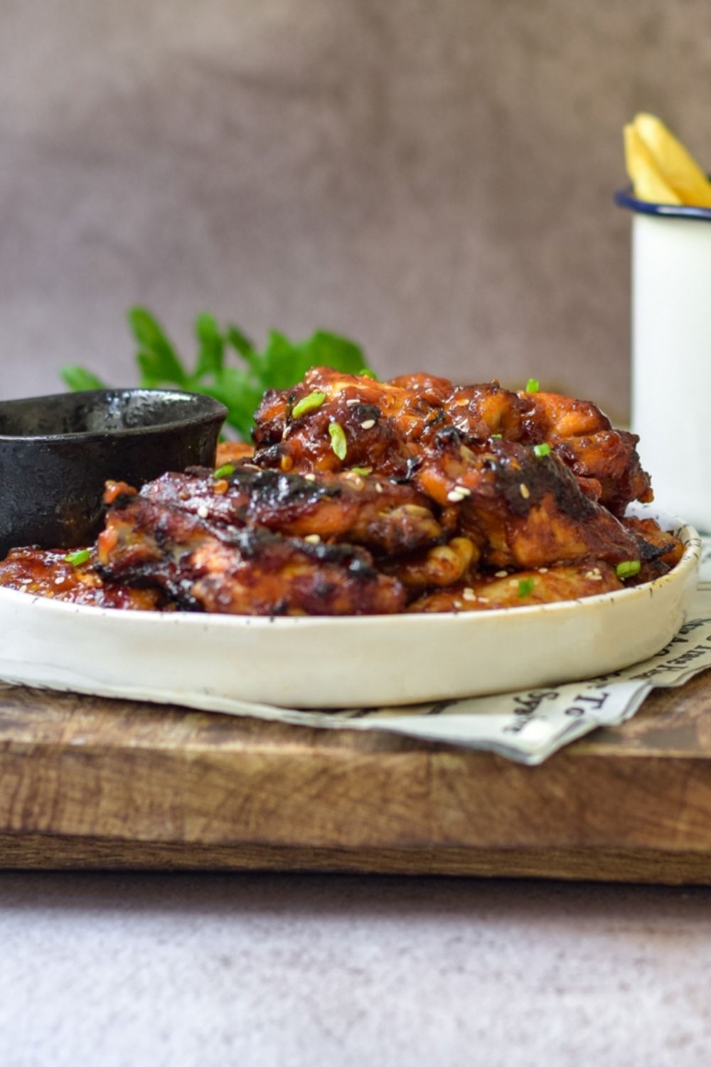 Spicy Sticky Baked Chicken Wings in a white plate