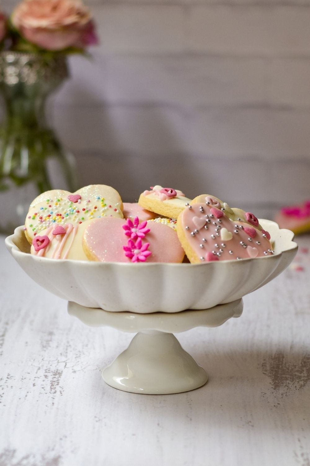 Sugar Cookies in a white bowl on a cake stand
