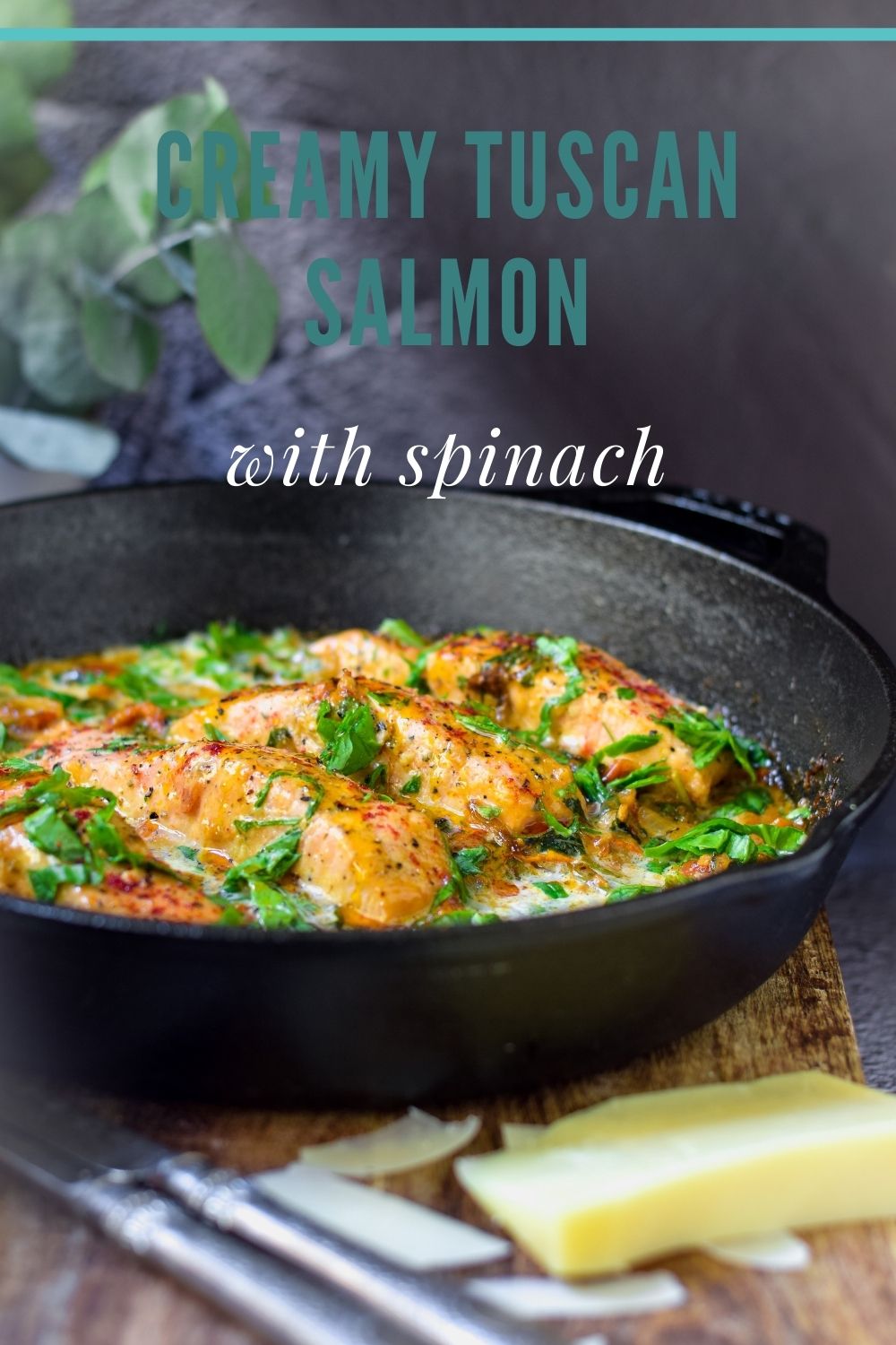 Creamy Tuscan Salmon with Spinach in a black pan