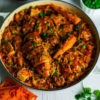 Chicken peri peri and rice in a white pot