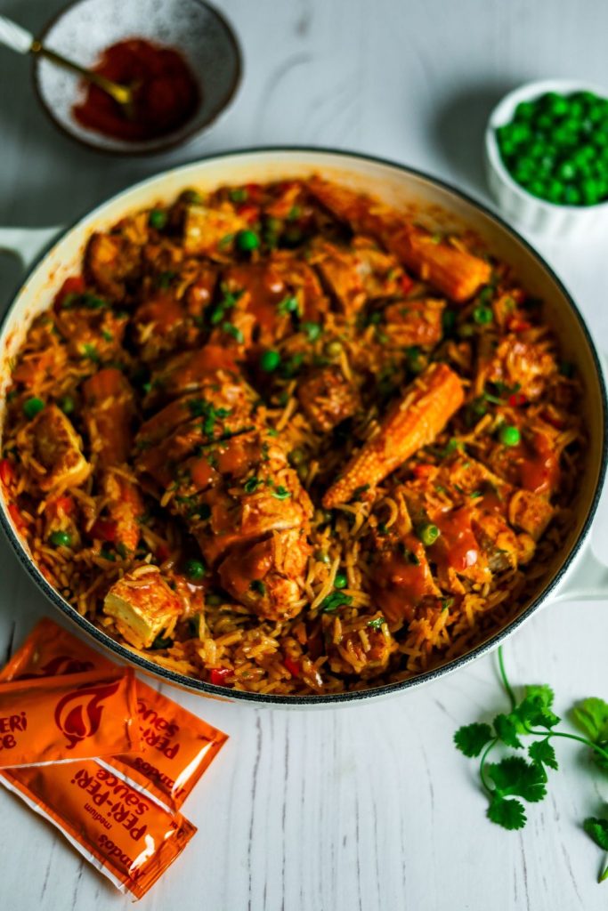 Chicken peri peri and rice in a white pot