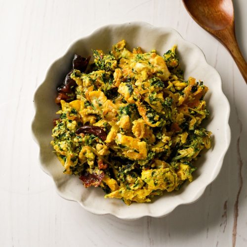 Methi and Eggs in a white bowl
