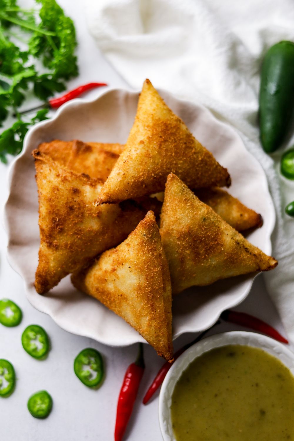 Chicken Cheese Jalapeno Samoosas in a white bowl 