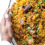 Lamb Akni in a white platter